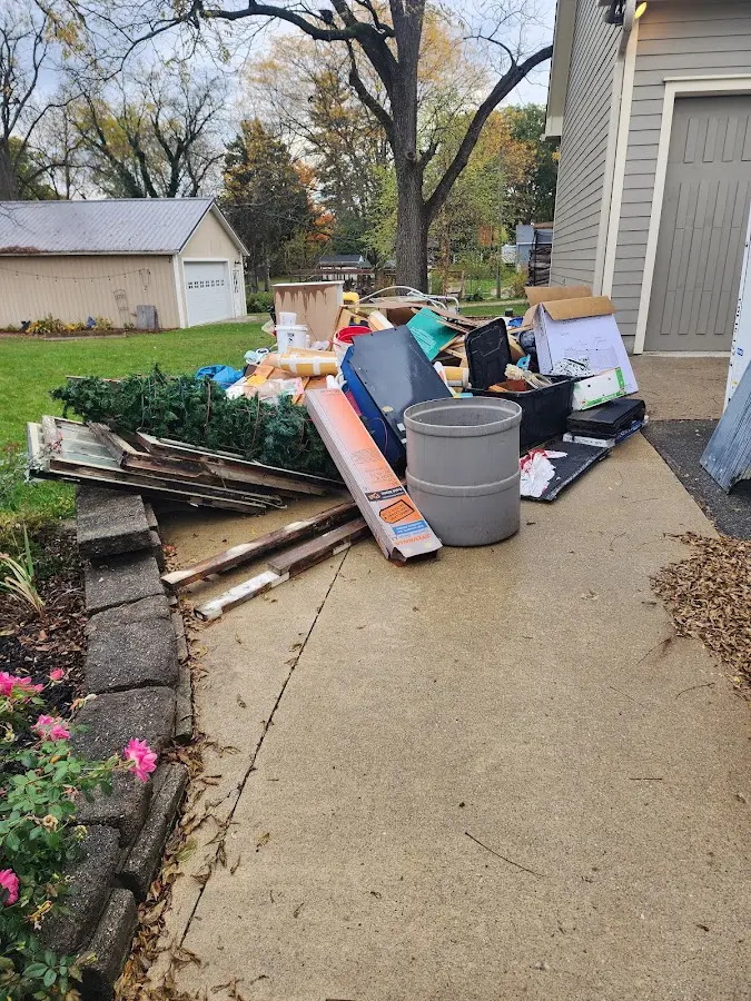 Dumpster being loaded with debris for Commercial Dumpster Rental in Lebanon